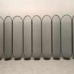 Arched frosted glass privacy screen with eight panels for larger lounges, suites, and open-plan interiors