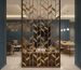 An elegant custom room divider in a high-end boutique hotel lounge.